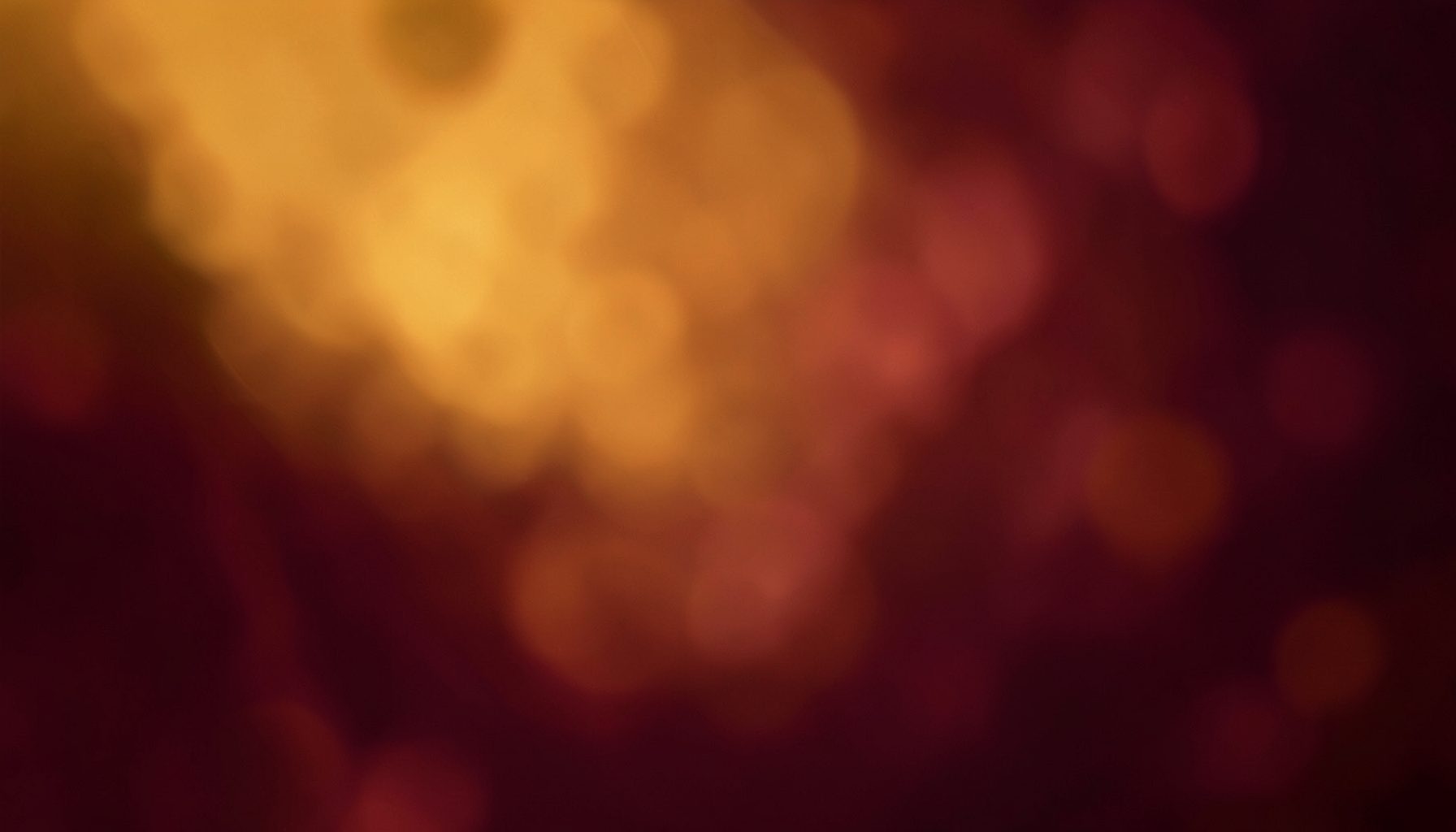 Warm amber and deep maroon abstract backdrop with soft bokeh, suggesting the emotional intensity of a family drama