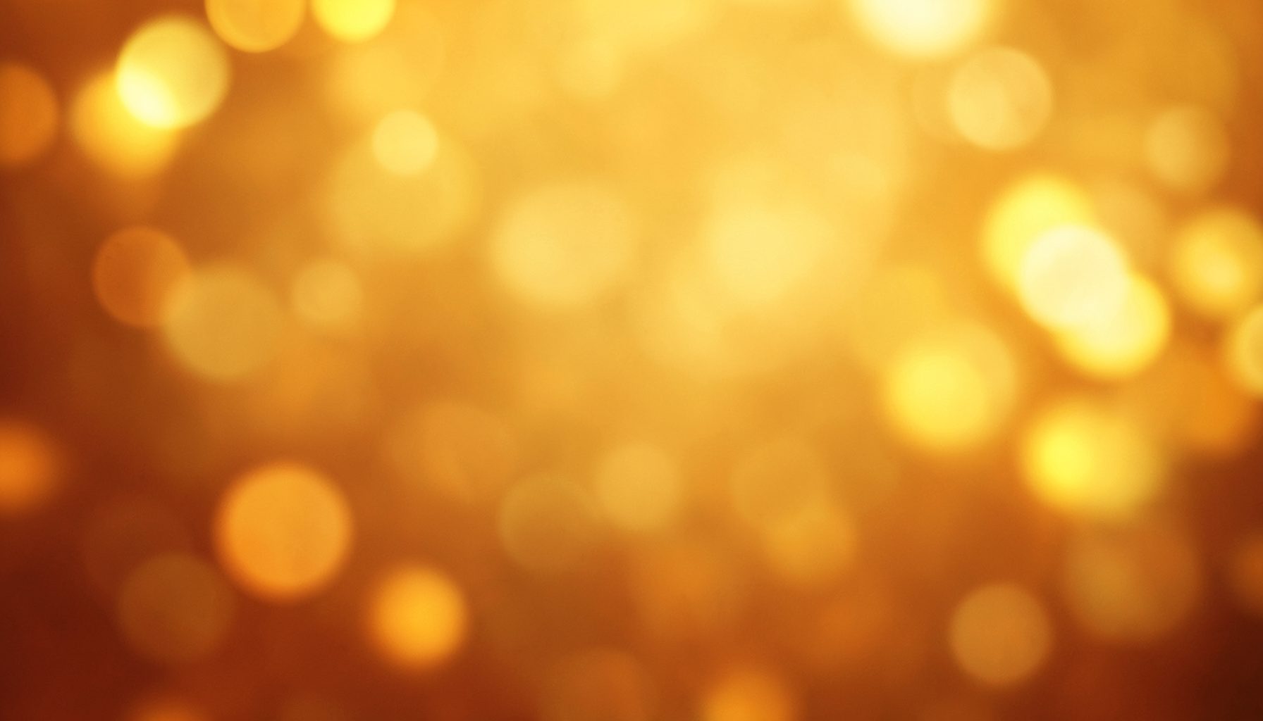 Warm amber and gold abstract backdrop with soft bokeh lights, evoking the emotional warmth of a family drama